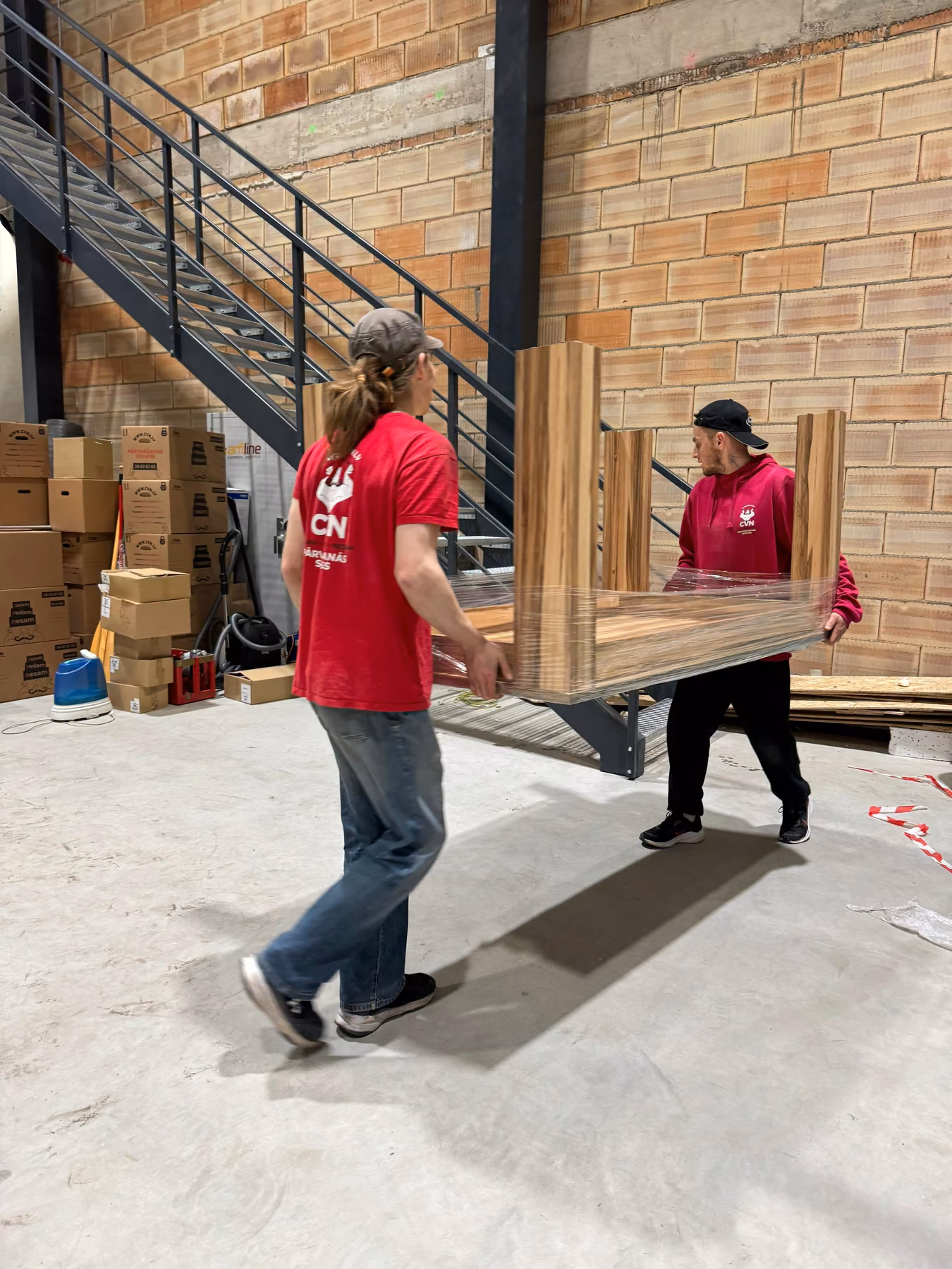 Movers carrying a large table