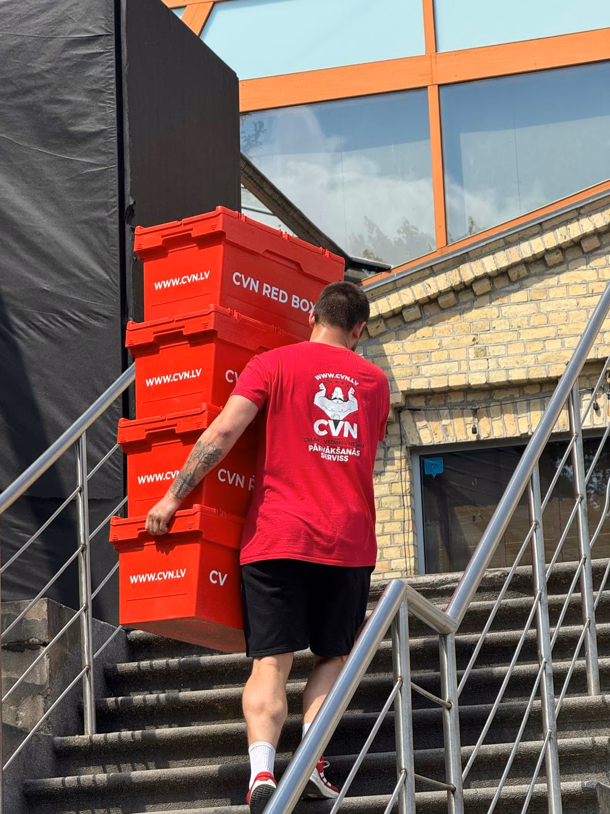 CVN Red Box crates carried up the stairs