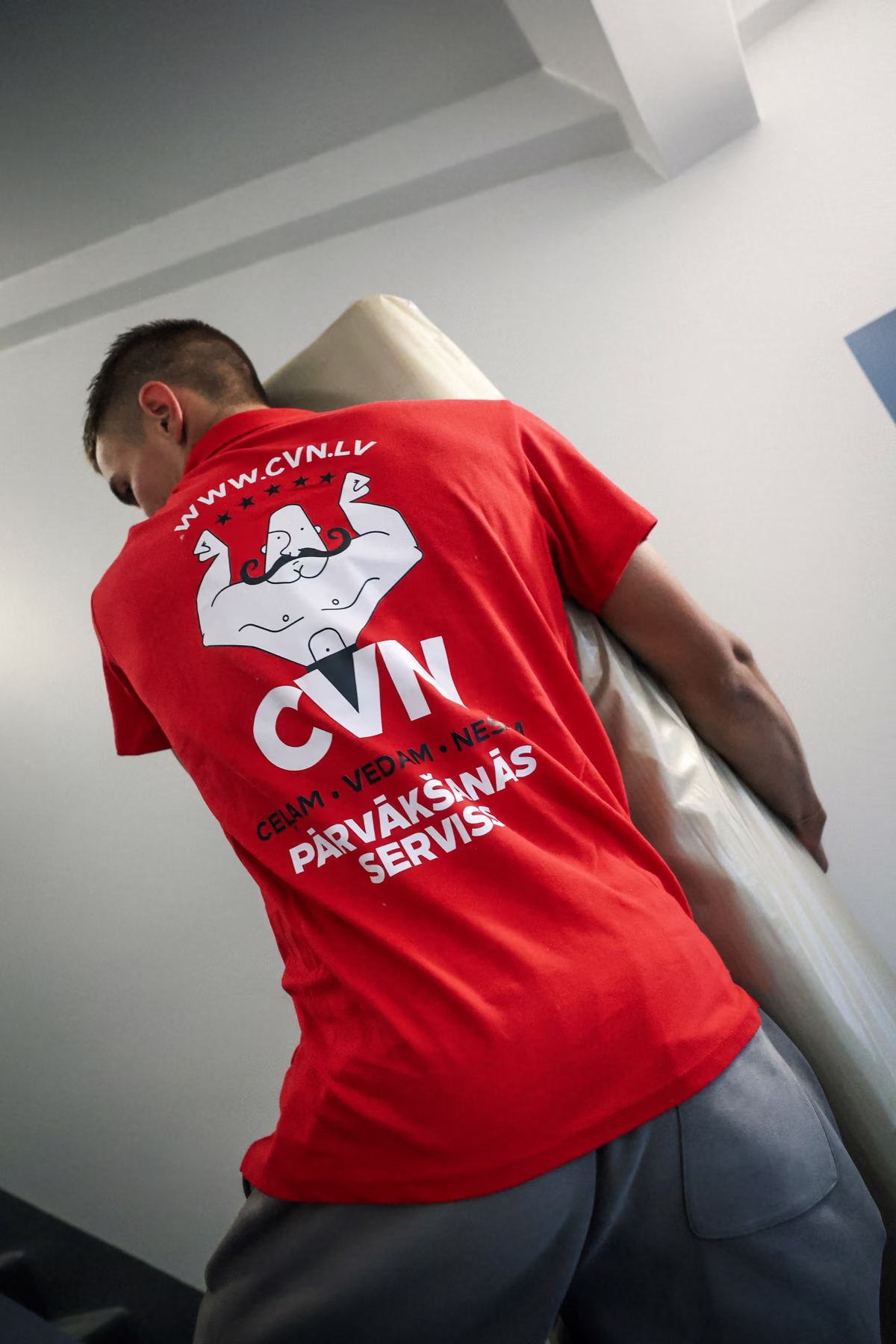 CVN mover carrying a wrapped mattress
