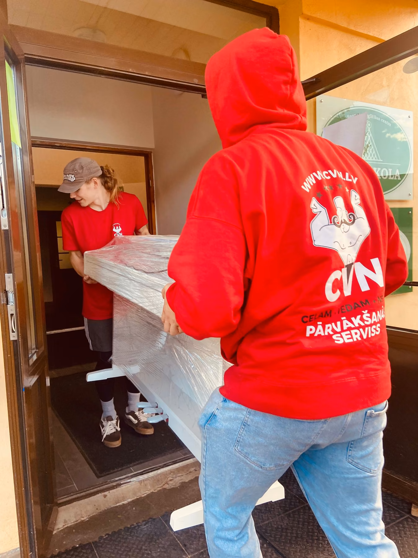Carrying furniture out through a door